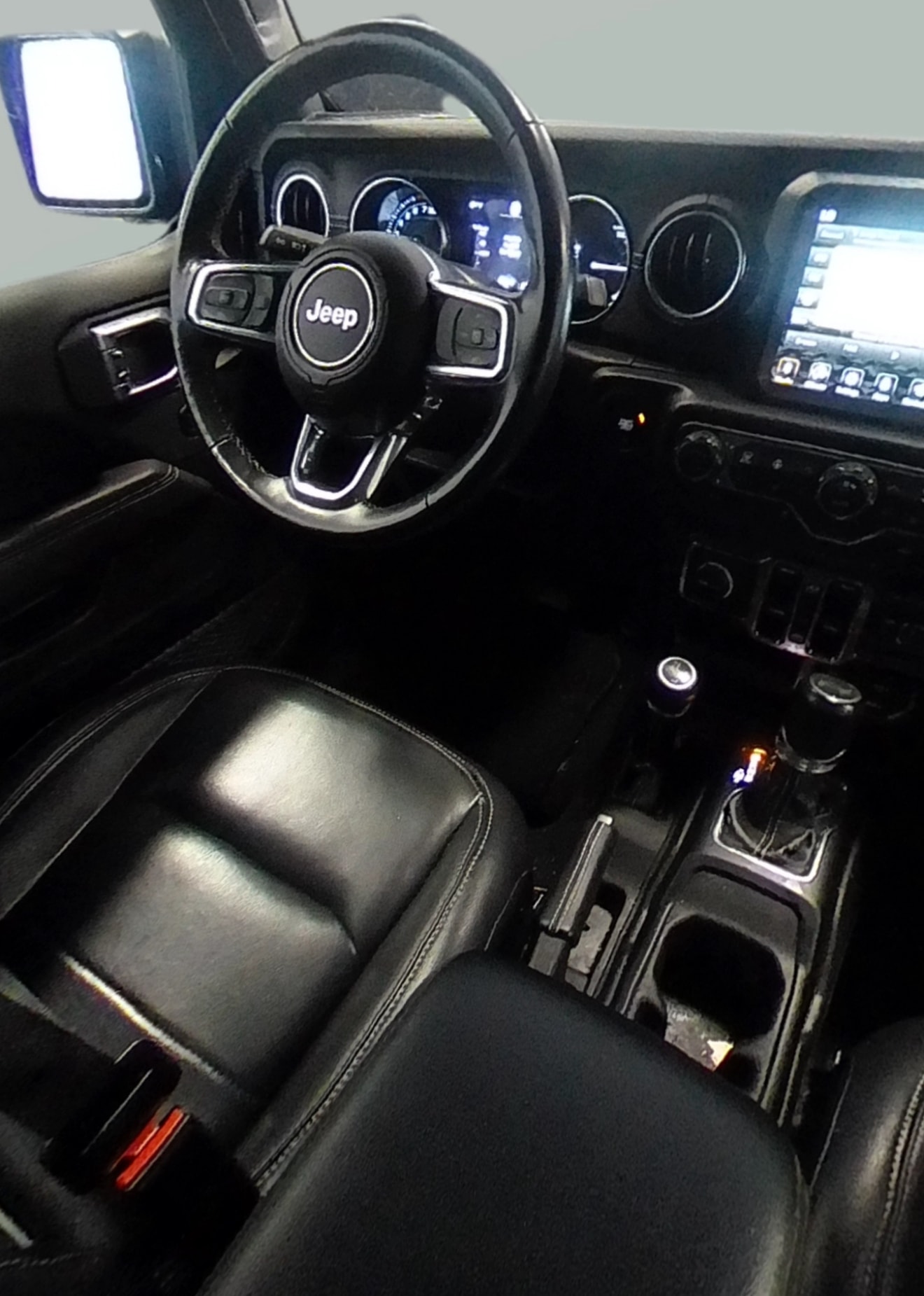 Jeep Wrangler interior with steering wheel and console